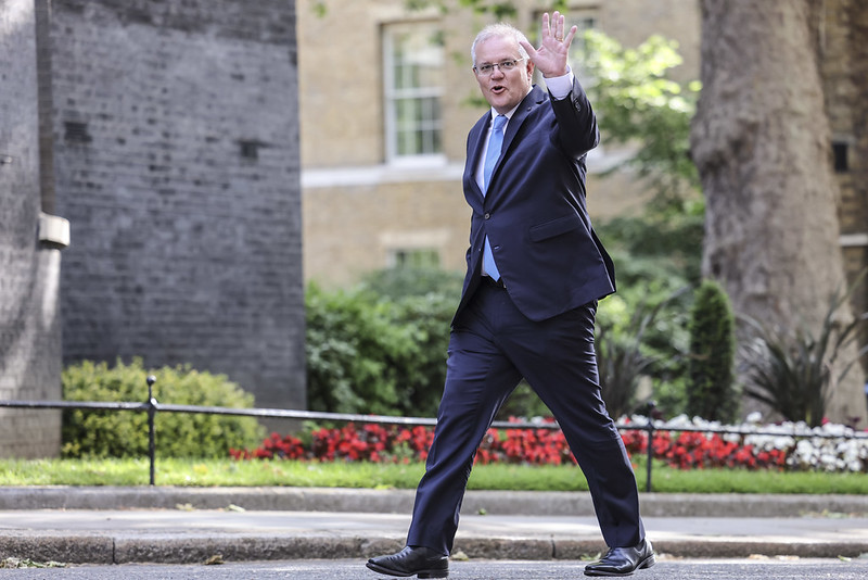 Scott Morrison waves to photographer