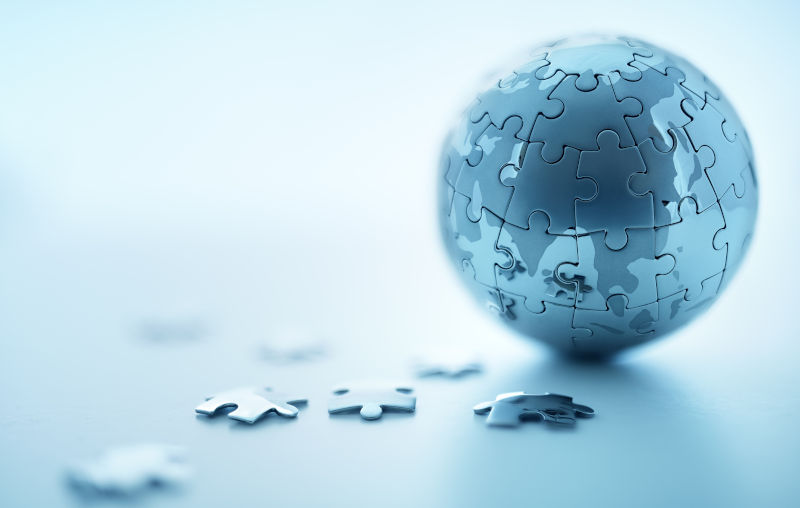 Global strategy solution concept - earth jigsaw puzzle