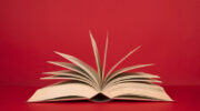 Openbookwithpagesonaredbackground. Image iStock / CreditMirasWonderland