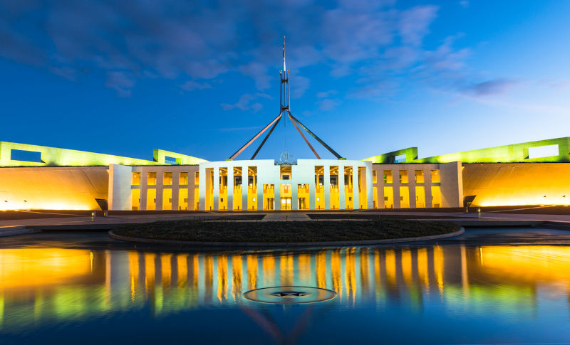 Australian Parliament House in Canberra With gold coloured reflections.