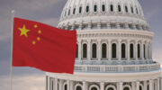 Beautiful flag of China waving with the strong wind and behind it the dome of the Capitol USA