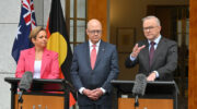 Minister for Communications Michelle Rowland, newly appointed ABC chair Kim Williams and Prime Minister Anthony Albanese at a press conference at Parliament House in Canberra, Wednesday, January 24, 2024. Former News Corp chief executive Kim Williams has been announced to replace Ita Buttrose at the ABC. Image: AAP Image/Mick Tsikas