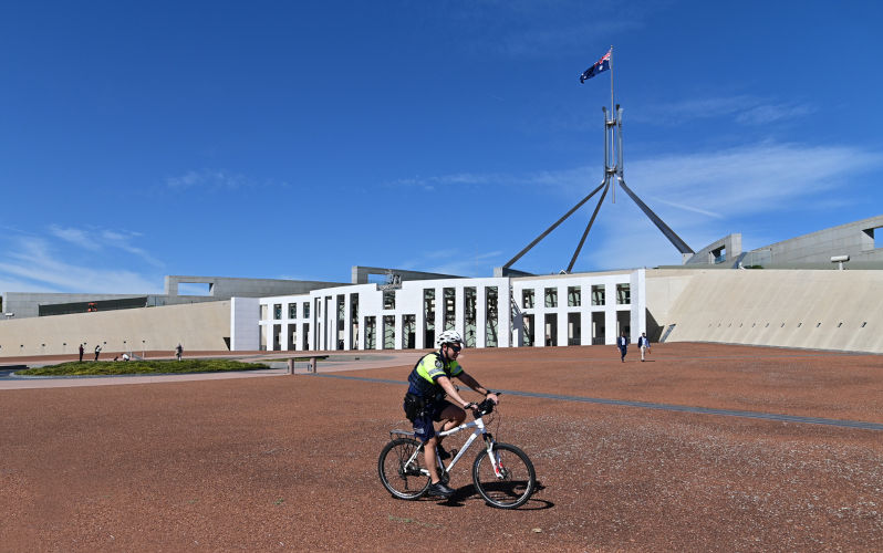 Canberra, Act - Mar 16 2023:Australian Federal Police bicycle guard Canberra Capital Hill Parliament House. ACT Police responsible for providing policing services in Australia Capital Territory.