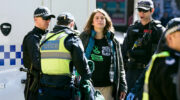 Violet Coco being arrested as part of a climate protest in 2019.