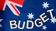 Budget wording on the Australian flag. Contributor: Michael Leslie / Alamy Stock Photo Image ID: K26WRX