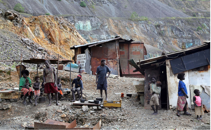 Family of the gold washers in the destroyed Panguna copper mine. Autonomous Region of Bougainville, Papua New Guinea. Contributor: Friedrich Stark / Alamy Stock Photo Image ID: CR3F0N