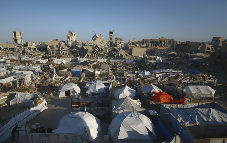 A view of the destruction as Palestinians continue their daily life with limited resources among the rubble of buildings destroyed as a result of Israeli attacks in Jabalia, Gaza on March 12, 2025. Approximately 2 million people were displaced in Gaza, with a population of 2.3 million, during the 15-month-long attacks of the Israeli army, targeting homes, hospitals, schools and shelters. Palestinians, who are deprived of the most basic needs such as shelter, food and clean water, are struggling with adverse weather conditions these days when the cold weather. Photo by Ramez Habboub/ABACAPRESS. Contributor: Abaca Press Image ID: 3A2PRP1