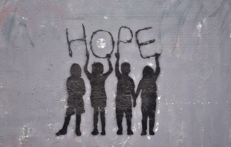 Hope graffiti on the Separation Wall Bethlehem West. Image: Alamy Contributor: Andrew BaumertBank 2AN7ND9