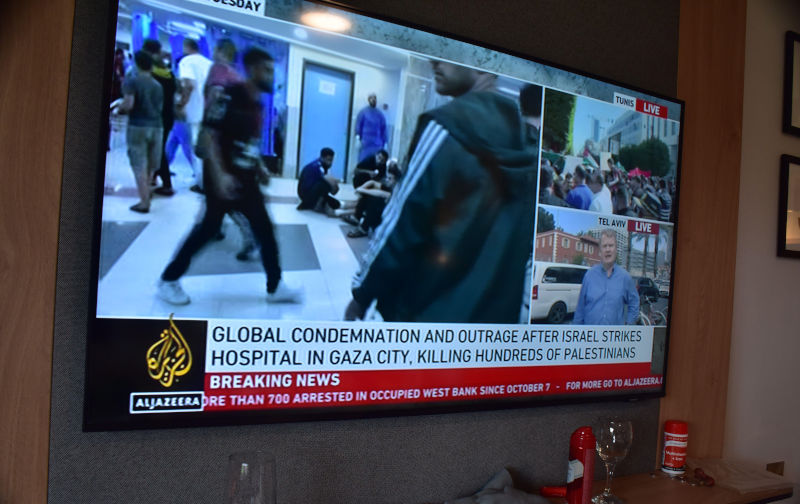 18th October, 2023. Various major TV channels report assertions on their chyrons of who was responsible for the bomb blast at the hospital in Gaza which killed hundreds, possibly thousands of people. Sky News reports the IDF press conference with evidence that it was caused by an Islamic Jihad misfired rocket, showing an infrared photo of the car park, saying there are no missile craters. Al Jazeera reports assertions it was carried out by Israel. The UK Foreign Office advises British citizens against all travel to Lebanon due to the risks as protesters take to the streets in Beirut. Image: Alamy. Contributor: Terry Waller Image ID: 2T2A6NP