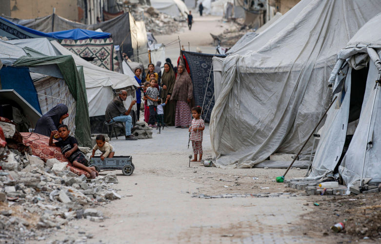 A view of the destruction as Palestinians continue their daily life with limited resources among the rubble and tents in Gaza. Image: Alamy. Contributor: Imago Image ID: 3BM3C52