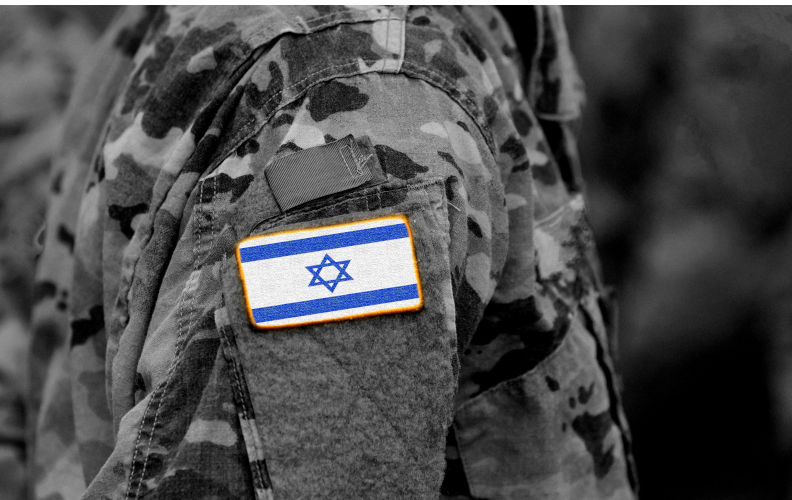 Israel flag on soldiers arm (collage).Image: Alamy Contributor: Bumble Dee Image ID: R3XPA7