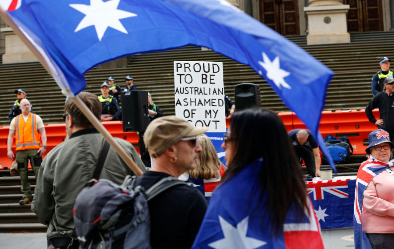 Melbourne, Australia. 13th Sep, 2025. Far-right protesters gather at Victoria Parliament ahead of their march through Melbourne's CBD. A far-right rally under the banner of ?Save Australia? was held in Melbourne today, drawing counter-protests from anti-racist and community activists. The event highlighted ongoing tensions in Australia over nationalism, immigration, and diversity, with Victoria Police intervening to separate the opposing groups and maintain order. (Photo by Ye Myo Khant/SOPA Images/Sipa USA) Credit: Sipa USA/Alamy Live News. Image: Alamy. Contributor: Sipa USA. Image ID:3CKP8J8
