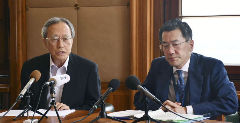 Shingo Yamagami (R), July 24, 2019. The Then head of the Japanese Foreign Ministry's Economic Affairs Bureau, and Junichi Ihara, ambassador of the Permanent Mission of Japan to the International Organisations in Geneva, speak at the World Trade Organisation headquarters in the Swiss city on July 24, 2019. The issue of Japan's tighter controls on exports to South Korea was taken to the WTO. (Kyodo)==Kyodo Photo via Credit: Newscom/Alamy Live News. Contributor: Newscom. Image ID:W4PRXT