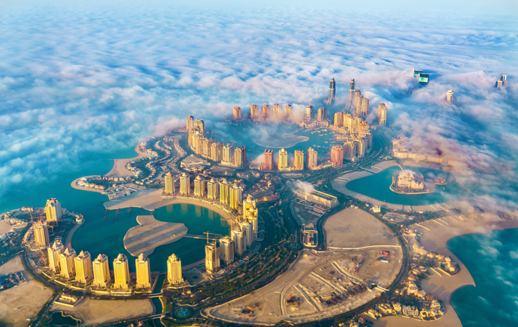 Aerial view of the Pearl-Qatar island in Doha through the morning fog. Qatar, the Persian Gulf. Image: iStock/Leonid Andronov