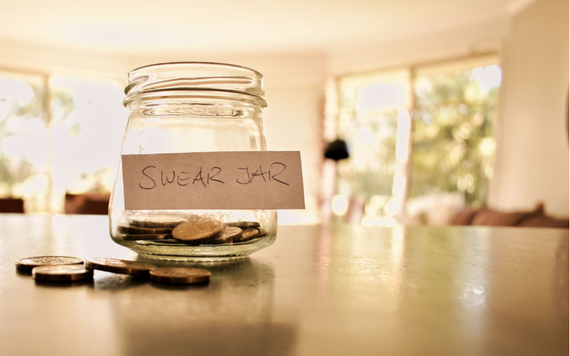 Swear jar filled with coins. Image: iStock / Anett Flassig