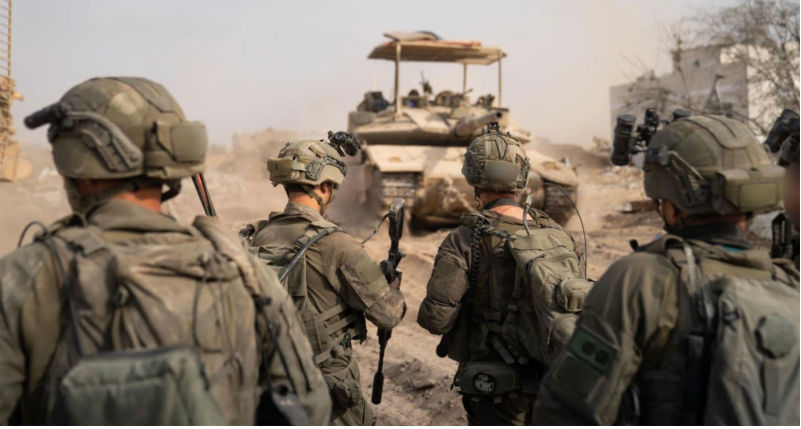 IDF (Israeli Defence Forces) soldiers following an APC in Gaza in 2025. Photo IDF. Image Alamy. ContributorPictorial Press Ltd. Image ID3CHJ9WR