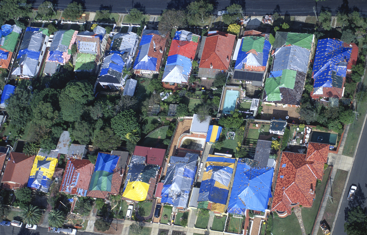 The Sydney suburb of Kensington after a huge hail storm rips through wrecking thousands of roofs and causing a billion dollars in damage. Every house has to have a temporary tarpaulin for months until permanent repairs can be made. April 1999 Image iStock Credit John Carnemolla