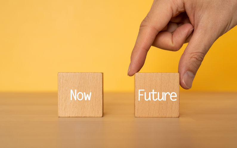 Wooden blocks with Now Future text of concept and a human hand. Image iStock CreditSeiya Tabuchi