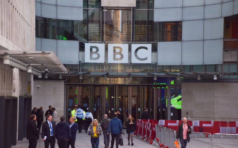 London, UK April 15 2025 people walk outside Broadcasting House, the BBC headquarters in central London. Image iStock VV Shots