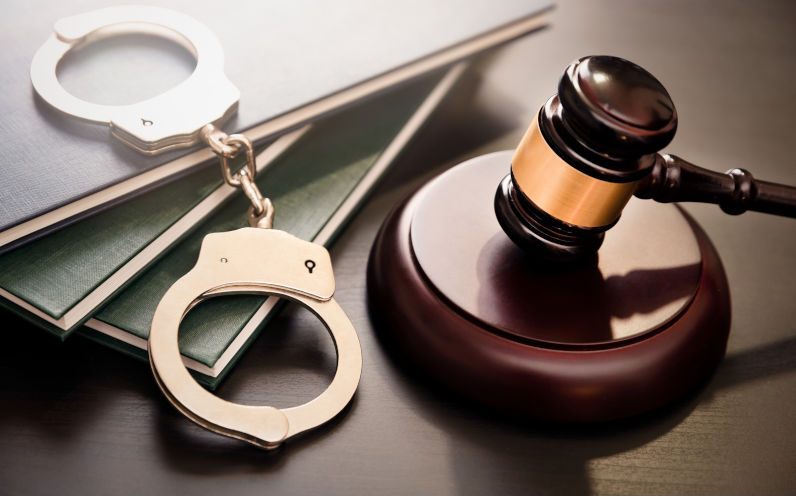 Handcuffs and wooden gavel. Crime and violence concept. Image iStock Creditsimpson33