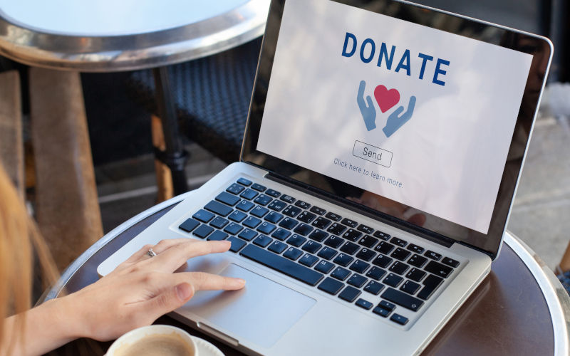 Donate to charity, donation concept. Give help by sending money. Image iStock anyaberkut