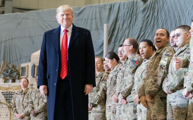 President Donald J. Trump visits troops at Bagram Airfield on Thursday, November 28, 2019, in Afghanistan, during a surprise visit to spend Thanksgiving with troops. Image Official White House Photo by Shealah Craighead Wikimedia Commons By The White House from Washington, DC President Trump Spends Thanksgiving with Troops in Afghanistan, Public Domain, https commons.wikimedia.org w index.php?curid=84572674