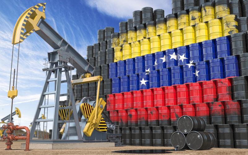 Oil production and extraction in Venezuela. Oil pump jack and oil barrels with Venezuelan flag. ImageiStock Credit Bet_Noire