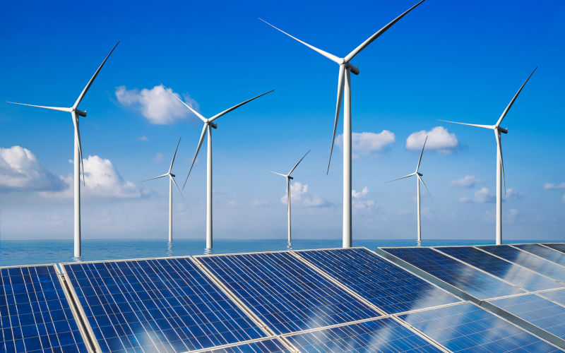 Solar panel and wind turbine farm clean energy. ImageiStock Blue Planet Studio