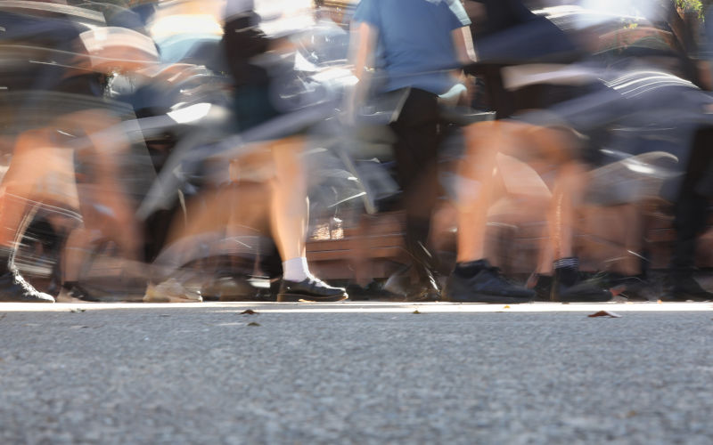 A deliberately blurred action or motion shot of school students. Image iStock Lincoln Beddoe