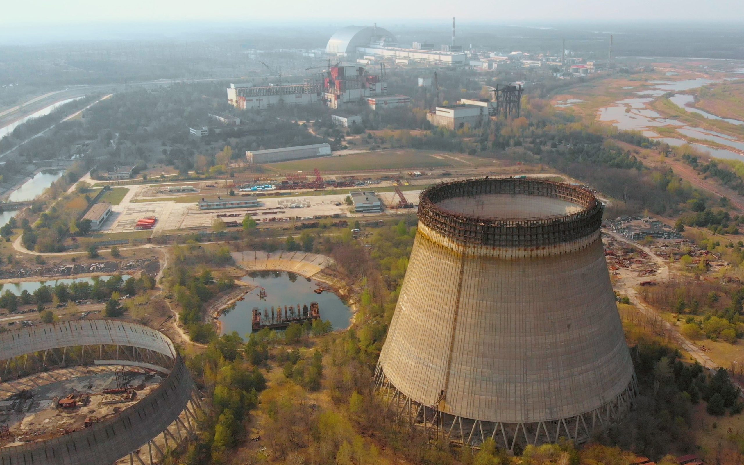 Aerial view of Chernobyl nuclear power plant. Cooling tower overlooking the nuclear power plant in Chernobyl. View of the destroyed nuclear power plant. Chernobyl nuclear power plant, Ukraine. Image iStock DeSid