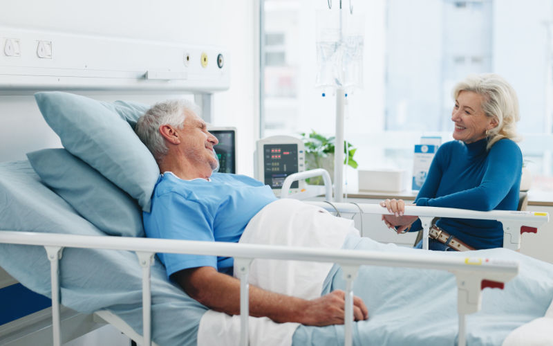 Private hospital room. senior patient and visitor . Image iStock Jacob Wackerhausen
