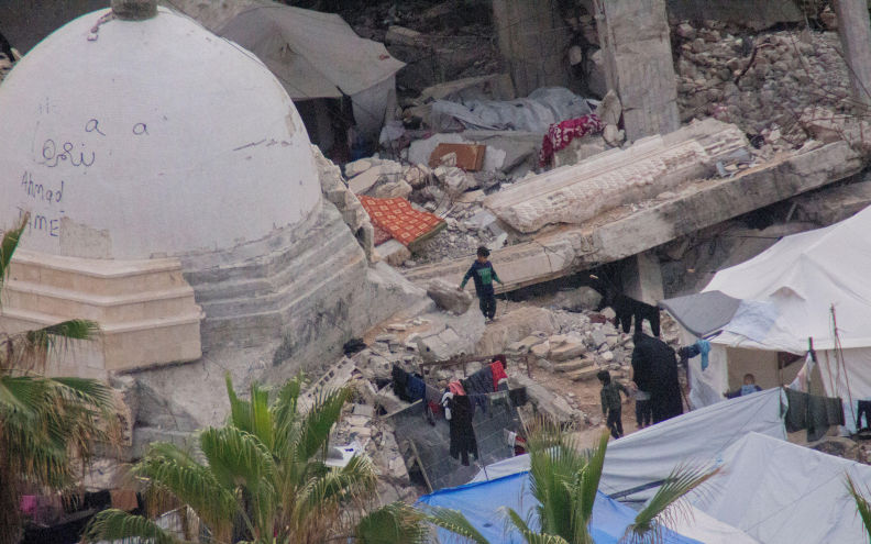 Children walk past a damaged mosque surrounded by rubble near Gaza port in Gaza Strip on February 9, 2026. Photo by Hassan Salem Middle East Images StringersHub Sipa USA) Alamy Image ID3DP2E06