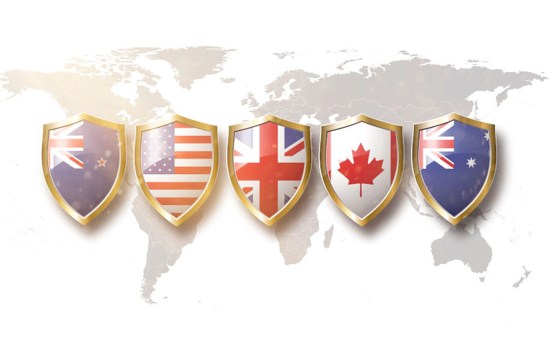 Australia, US, UK Canada, and New Zealand flags in golden shields on world map background.5 eyes alliance. Image wirstock alamy Alamy ID 2GMAKY1