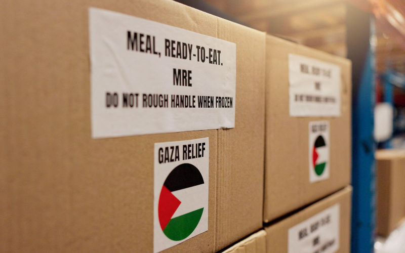Export, Palestine and charity with box in warehouse for logistics, food package and donation. NGO distribution, Gaza relief and humanitarian aid. Image Yuri Arcurs Alamy image ID3BJYNYX