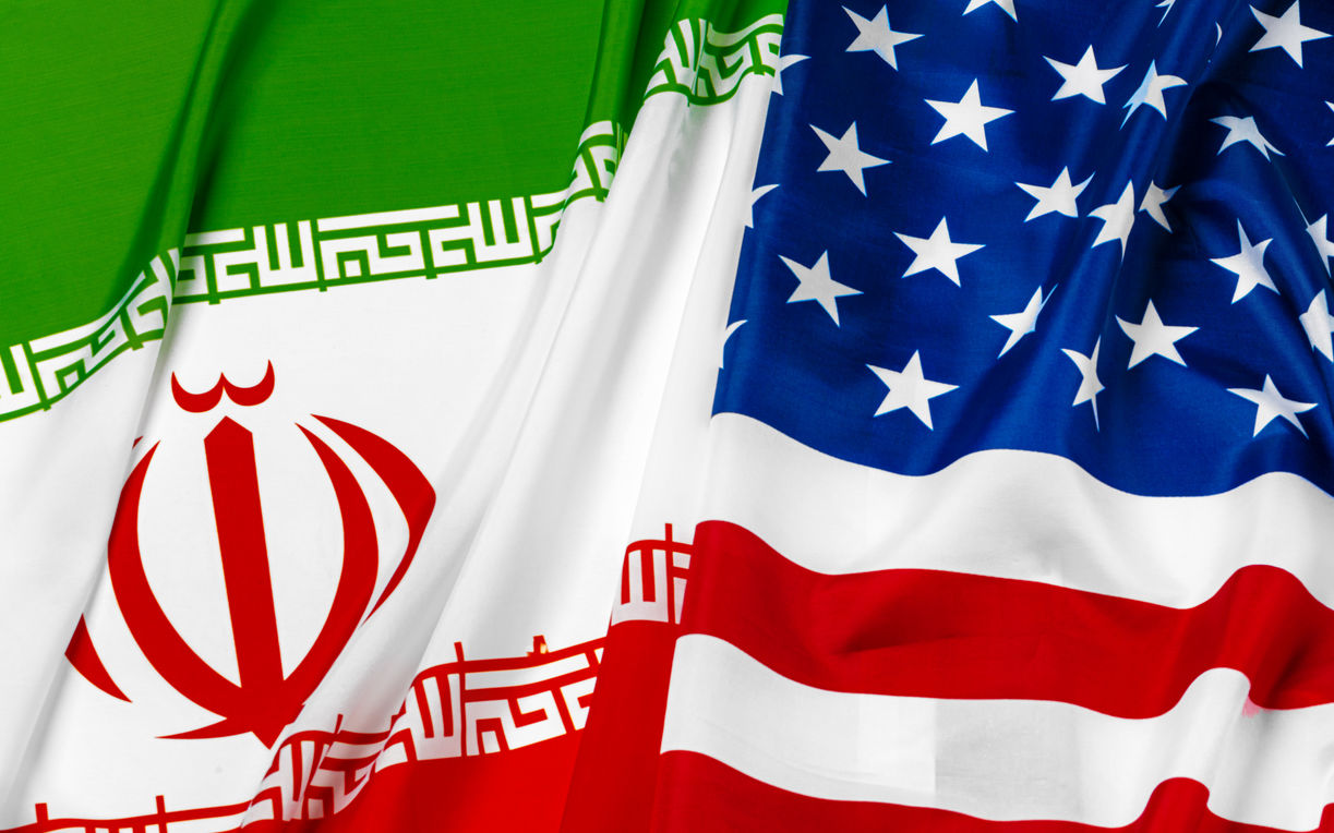 Flag of Iran together with flag of the United States of America. Image iStock FabrikaCr