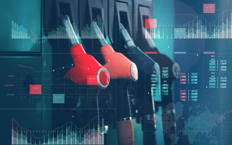 Gas station with fuel dispensers on technological background. Image iStock vadishzainer