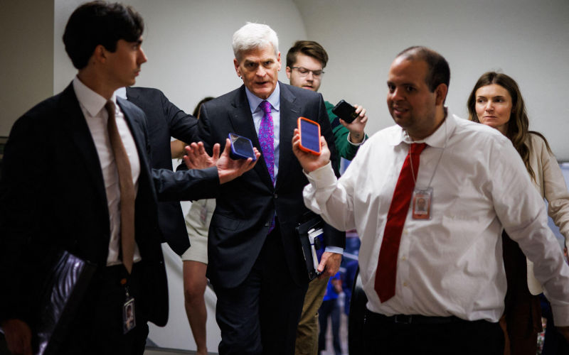 Washington, United States. 20th May, 2026. U.S. Senator Bill Cassidy (RLA) is surrounded by reporters as he heads to the floor of the Senate for a vote in the U.S. Capitol building on May 20, 2026 in Washington, DC Cassidy, who has been a rare vocal critic of certain policies of the Trump Administration, lost his reelection bid over the weekend in the Louisiana Republican primary race. Photo Samuel Corum Sipa USA. Alamy ID3EGNKYA