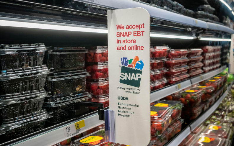 A sign in a Target store in Chelsea in New York announces that the store accepts SNAP (Supplemental Nutrition Assistance Program) that has been cut by the current Trump administration. Image Richard B. Levine. Alamy image ID2Y9TBWY