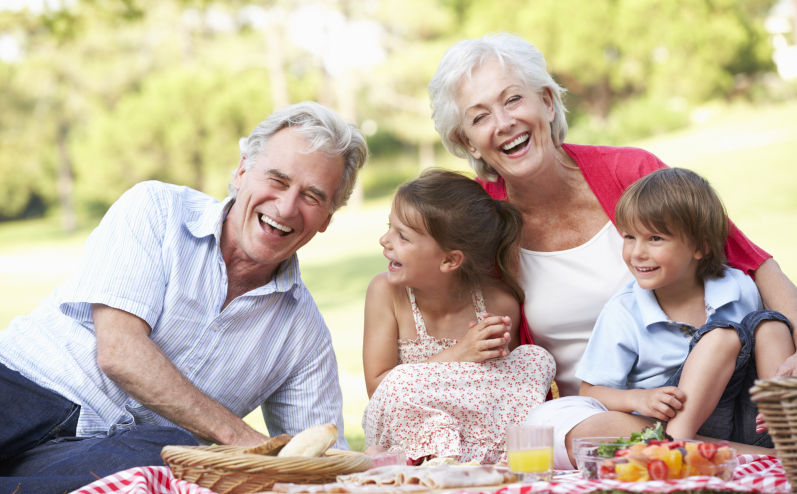 Grandparents and their grandchildren having a picnic