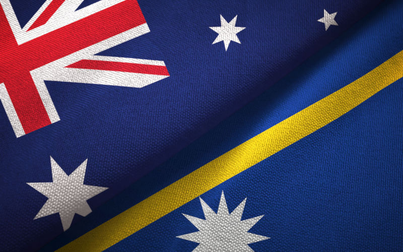 Nauru and Australia flags together textile cloth, fabric texture Image iStock Oleksii Liskonih