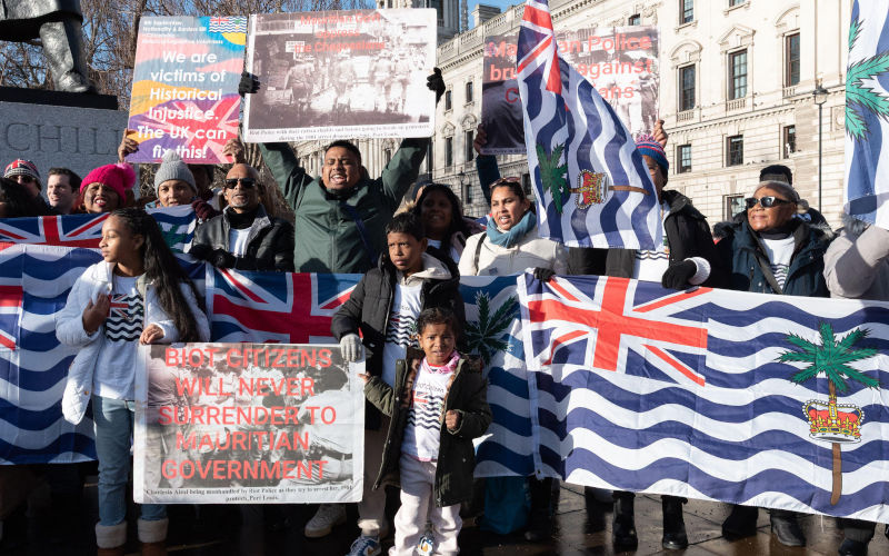 London, UK. 7 January, 2026. Members of the British Chagossian community protest outside Parliament during Prime Ministers Questions against legislation that would grant sovereignty of the Chagos Islands to Mauritius. The archipelago is currently British Indian Ocean Territory and hosts a joint UK US military base on its largest island, Diego Garcia. Indigenous communities were forcibly expelled by the UK in the 1960s to make way for the base. Credit Ron Fassbender Alamy Live News Image ID 3DEFA66