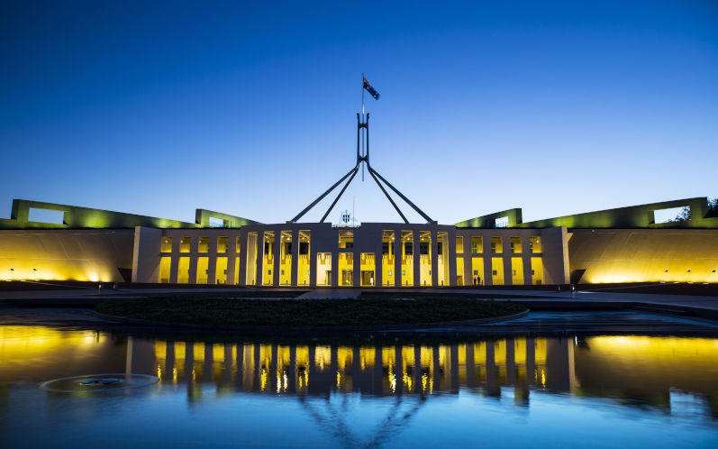 Parliament House Canberra Australia with a ripple in the water. Image iStock TonyFeder