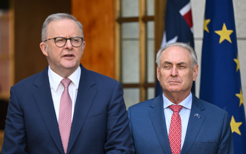 Australian Trade Minister Don Farrell listens to Australian Prime Minister Anthony Albanese speak to the media during a press conference with President of the European Commission Ursula von der Leyen at Parliament House in Canberra, Tuesday, March 24, 2026. Image AAP lukas Coch