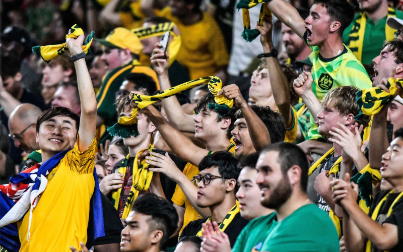 Sydney, Australia. 20 Mar 2025, multicultural Socceroo fans celebrate Australias goal during the FIFA World Cup 2026 Asian Qualifier, Australia v Indonesia. Image Kleber Osorio Alamy Live News Image ID 3A4YWG7