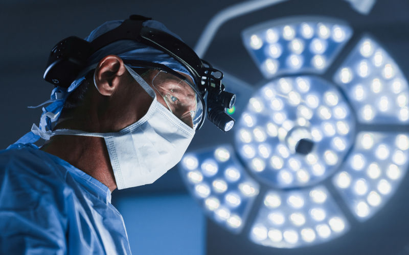 Senior male surgeon in operating room with surgery equipment. Image iStock Inside Creative House