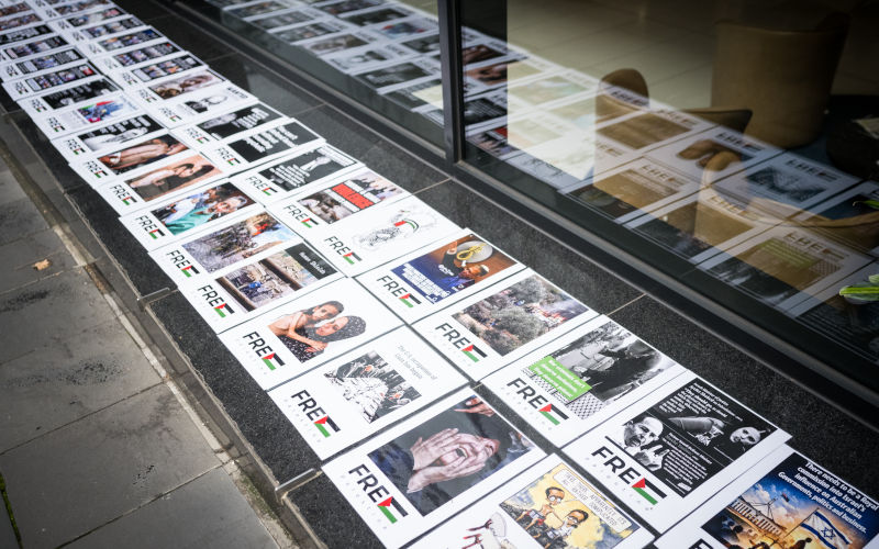 Posters protesting the imbalance of the matter outside the Royal Commission on Antisemitism and Social Cohesion in Melbourne, Monday, July 13, 2026. Image AAP Christopher Hopkins