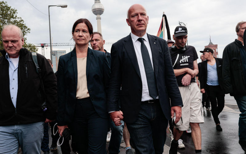 Berlin, Germany. 26th July, 2026. Berlin Mayor Kai Wegner and his wife take part in a mourning march from St. Marys Church to the Brandenburg Gate for the victims of the CSD Pride parade attack. On the evening of July 25, a car drove into people in Tiergarten park, killing one person and injuring 29 others. Authorities are searching for the suspected attacker. Image SOPA Images Limited Alamy Live News Alamy Image ID 3F41Y0H