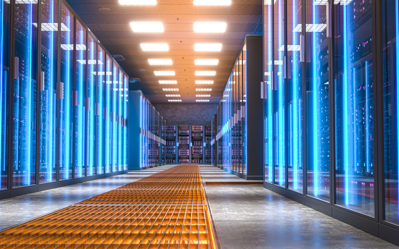 Data centre room with bright blue lights illuminating the corridor. Image iStock tiero