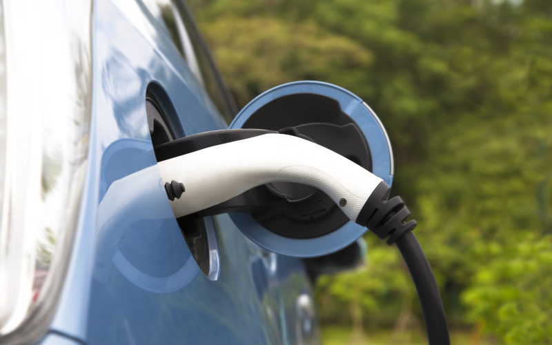 A blue electric vehicle charging. Image iStock Tomwang112