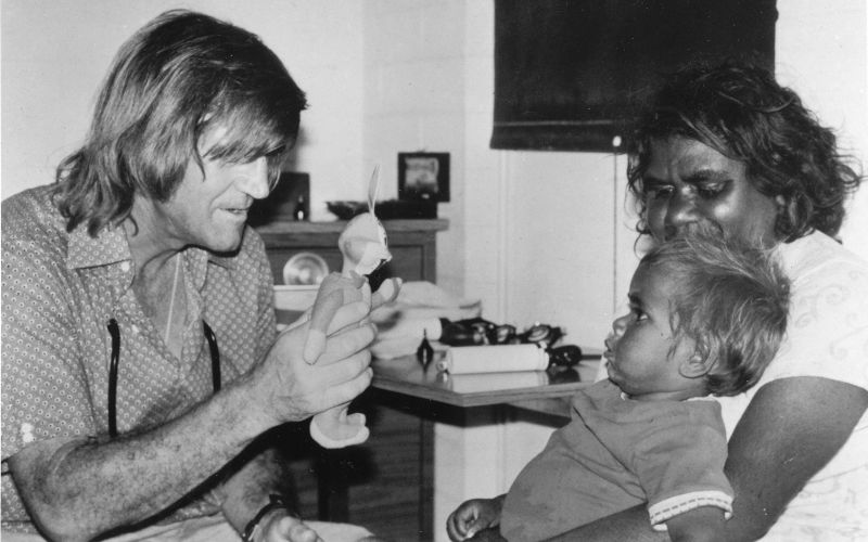 Fred Hollows with a young Indigenous patient during the National Trachoma and Eye Health Program in the 70s. Image The Fred Hollows Foundation